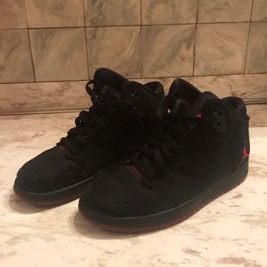 Red and black Jordan shoes.